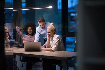 Image showing Multiethnic startup business team in night office