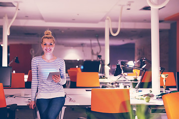 Image showing woman working on digital tablet in night office