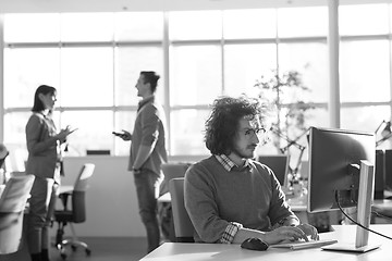 Image showing businessman working using a computer in startup office