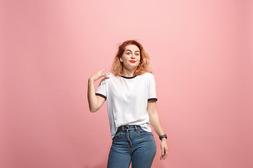 Image showing Beautiful woman looking suprised isolated on pink