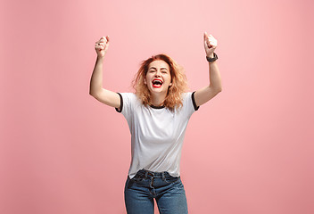 Image showing Winning success woman happy ecstatic celebrating being a winner. Dynamic energetic image of female model