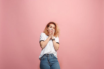 Image showing Portrait of the scared woman on pink