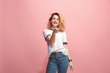 Image showing The happy business woman point you and want you, half length closeup portrait on pink background.