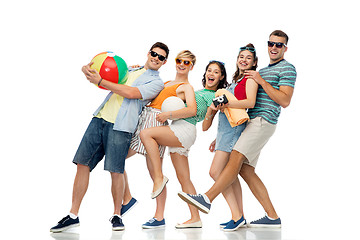 Image showing happy friends with beach and summer accessories