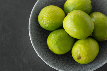 Image showing close up of whole limes in bowl