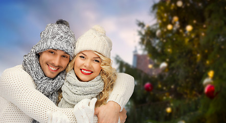 Image showing happy couple hugging over christmas tree