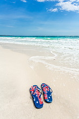 Image showing Aussie thongs on beach in summer