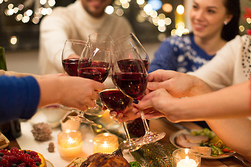 Image showing close up of friends with wine celebrate christmas