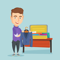 Image showing Young man packing his suitcase vector illustration