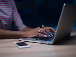 Image showing black businesswoman using a laptop in startup office