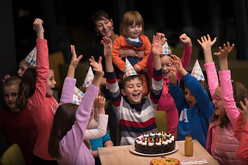 Image showing The young boy joyfully celebrating his birthday