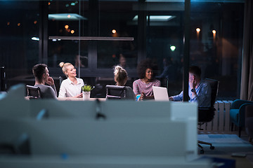 Image showing Multiethnic startup business team in night office