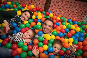 Image showing young parents with kids in a children\'s playroom