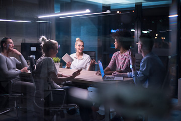 Image showing Multiethnic startup business team in night office