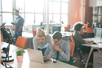 Image showing Two Business People Working With laptop in office