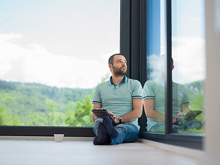 Image showing man on the floor enjoying relaxing lifestyle