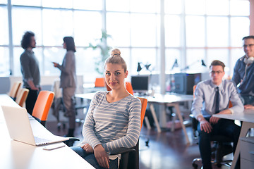 Image showing businesswoman using a laptop in startup office