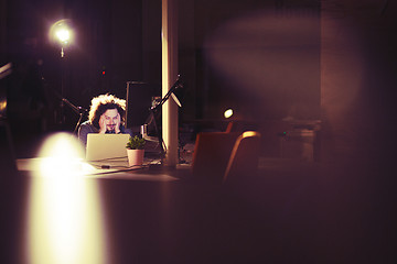 Image showing businessman relaxing at the desk