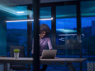 Image showing black businesswoman using a laptop in startup office