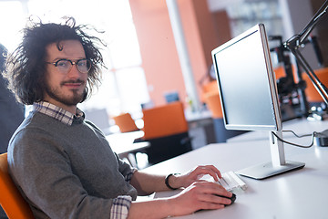 Image showing businessman working using a computer in startup office