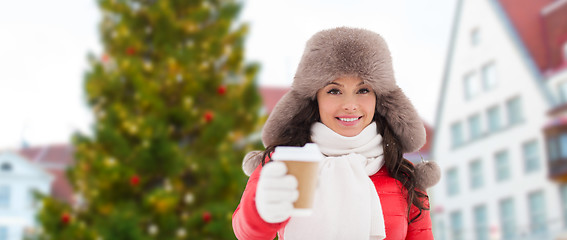 Image showing woman with coffee over christmas tree in tallinn