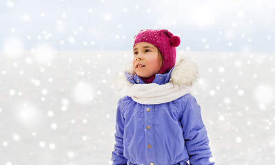 Image showing happy little girl in winter clothes outdoors