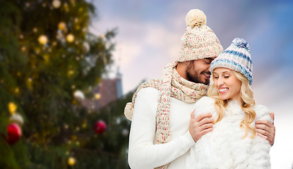 Image showing happy couple hugging over christmas tree