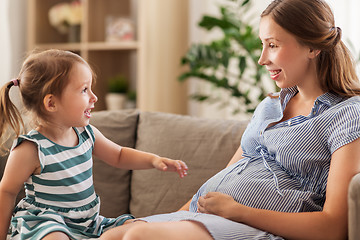 Image showing pregnant mother and daughter at home