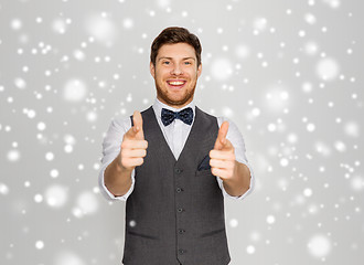 Image showing happy man in festive suit pointing to you