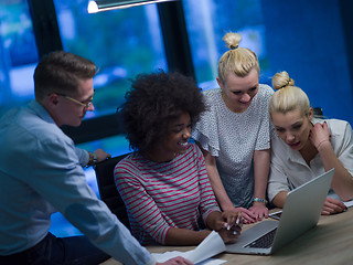 Image showing Multiethnic startup business team in night office