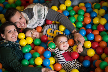 Image showing young parents with kids in a children\'s playroom