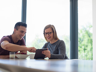 Image showing couple enjoying morning coffee and strawberries