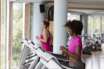 Image showing people exercisinng a cardio on treadmill in gym