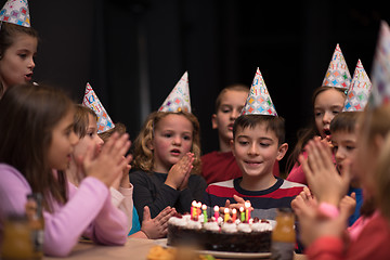 Image showing The young boy joyfully celebrating his birthday