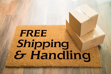 Image showing Free Shipping and Handling Welcome Mat On Wood Floor With Shipme