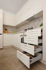 Image showing Modern beige colored kitchen and dining room