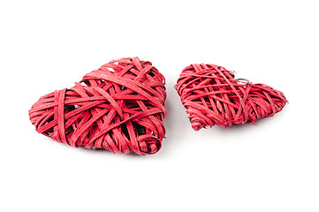 Image showing Two red hearts made of straw, isolated on white
