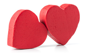 Image showing Two red wooden hearts isolated on white