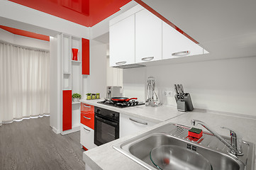 Image showing Modern red and white kitchen interior