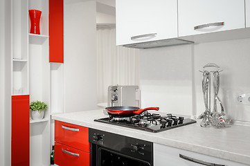 Image showing Modern red and white kitchen interior