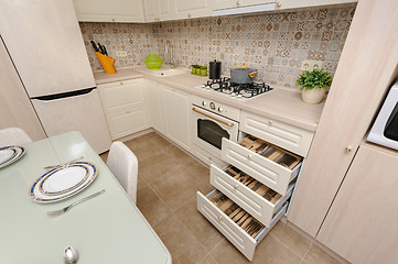 Image showing Modern beige colored kitchen and dining room