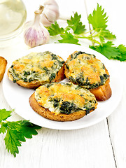 Image showing Sandwich of nettle and cheese in plate on light board