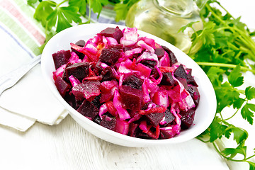 Image showing Vinaigrette with cabbage in bowl on board