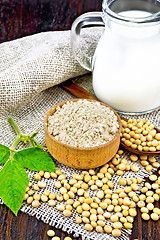 Image showing Flour soy in bowl with soybeans and milk on wooden board