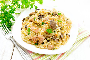 Image showing Risotto with mushrooms and chicken on napkin