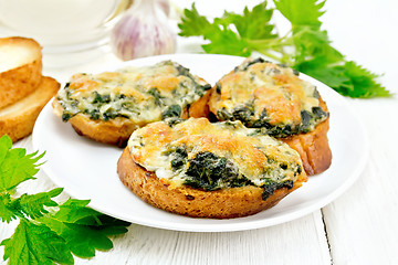 Image showing Sandwich of nettle and cheese in plate on white board