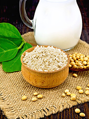 Image showing Flour soy in bowl with soybean and leaf on board