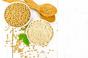 Image showing Flour soy with soybeans and leaf on board top