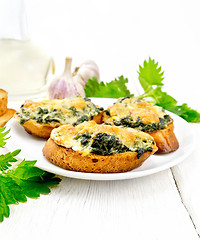 Image showing Sandwich of nettle and cheese in plate on board