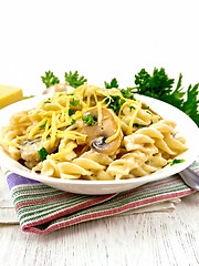 Image showing Fusilli with mushrooms and cream on napkin